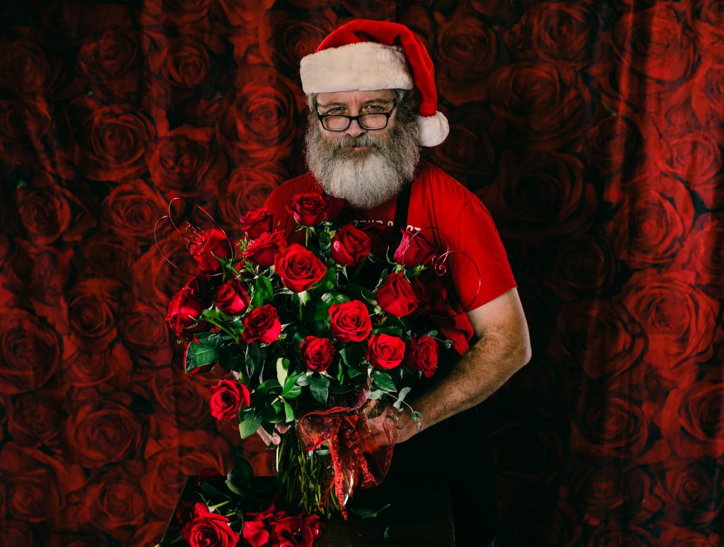 John Gluth Poses With Roses as Florist Santa