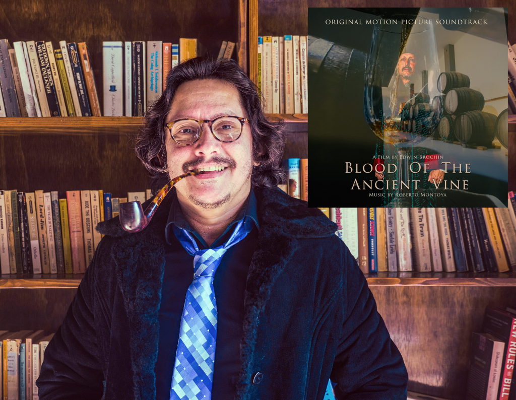 Composer Roberto Montoya with inset album cover for his "Blood Of The Ancient Vine" soundtrack