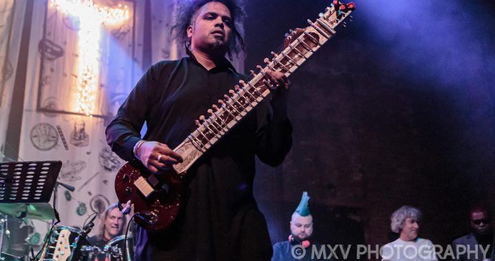 Aji Jafri of The Shadow Majlis Onstage with a sitar