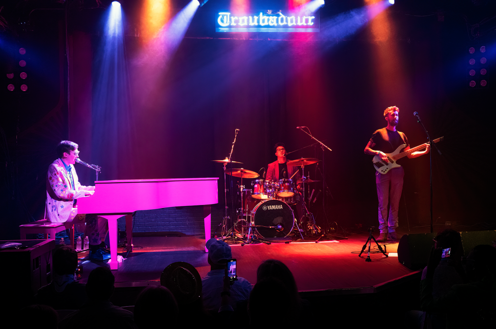 Photo of Tom's Elton Tribute with Tom Cridland on piano and vocals, Harry Michael on drums and Justin Woodward on bass, live at The Troubadour in West Hollywood.