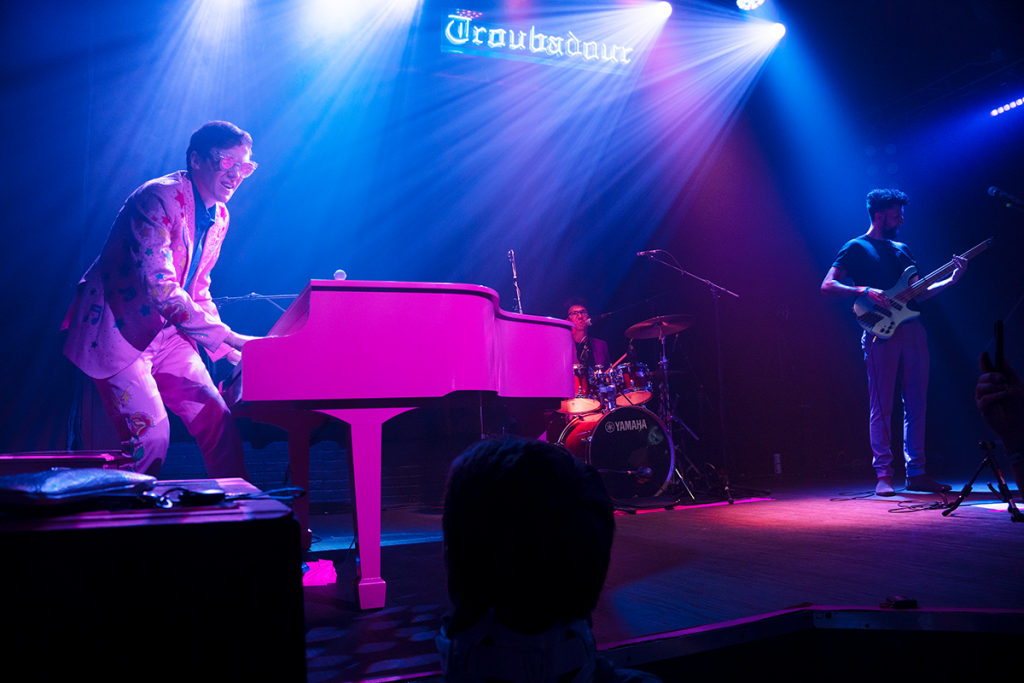 Photo of Tom's Elton Tribute with Tom Cridland on piano and vocals, Harry Michael on drums and Justin Woodward on bass, live at The Troubadour in West Hollywood.