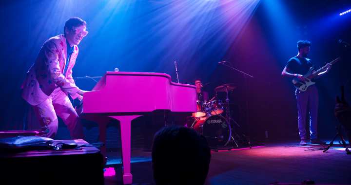 Photo of Tom's Elton Tribute with Tom Cridland on piano and vocals, Harry Michael on drums and Justin Woodward on bass, live at The Troubadour in West Hollywood.